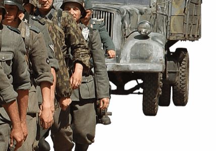 Soldiers marching in uniform beside a military truck.